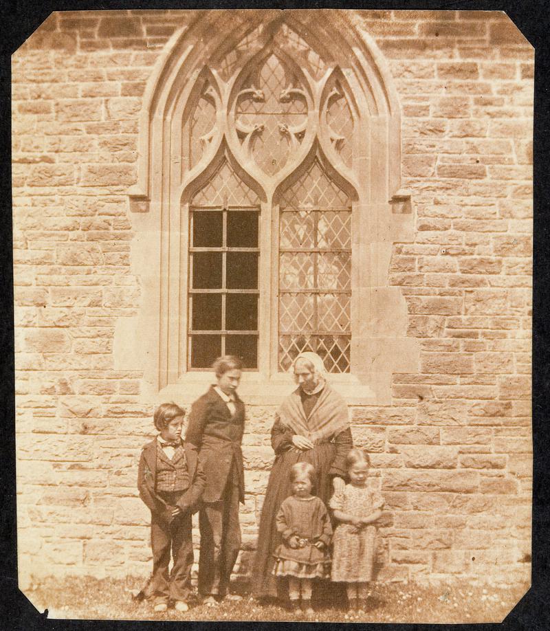 Lady and children outside church