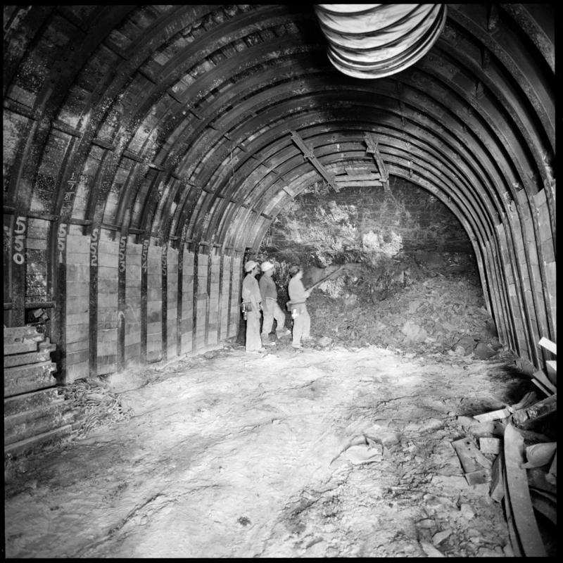 Black and white film negative showing three men at a heading, Merthyr Vale Colliery 2 July 1981.  &#039;2 Jul 1981&#039; is transcribed from original negative bag.