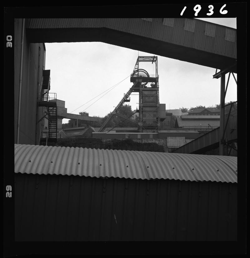 Black and white film negative showing a view of the upcast shaft headgear, Oakdale Colliery, May 1980.  &#039;Oakdale May 1980&#039; is transcribed from original negative bag.