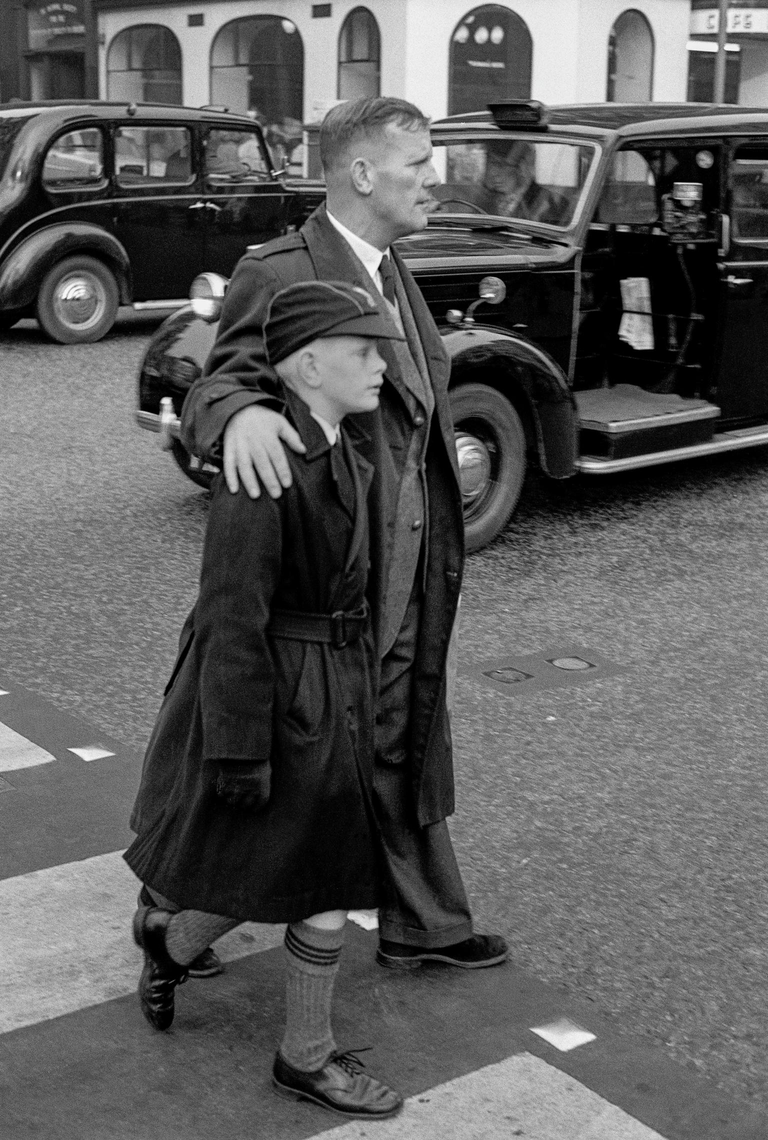A father and schoolboy son walk in central London. Taken on a Contax 2 camera (first professional camera)