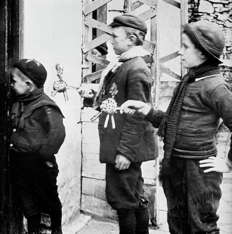 Three boys collecting and singing Calennig at Llangynwyd