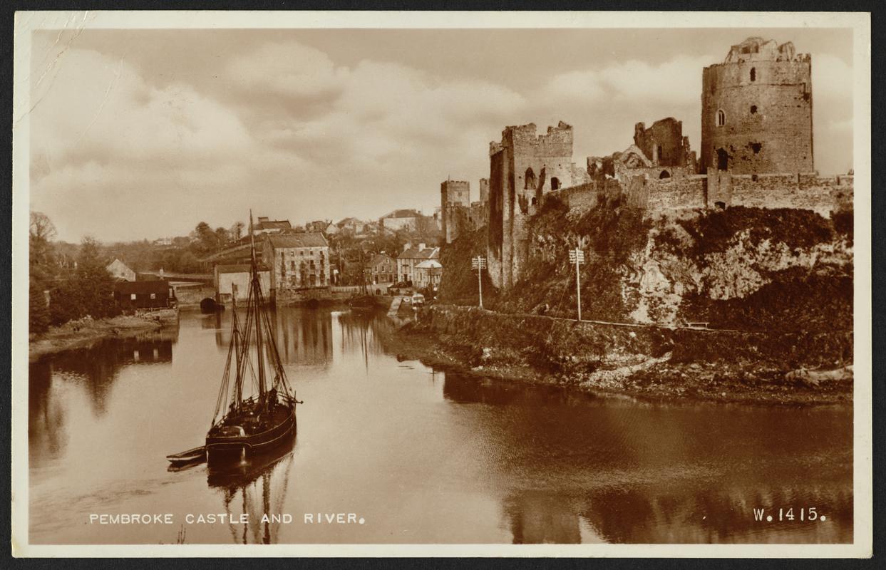 Postcard showing Pembroke Castle with a ketch on the river in the foreground.