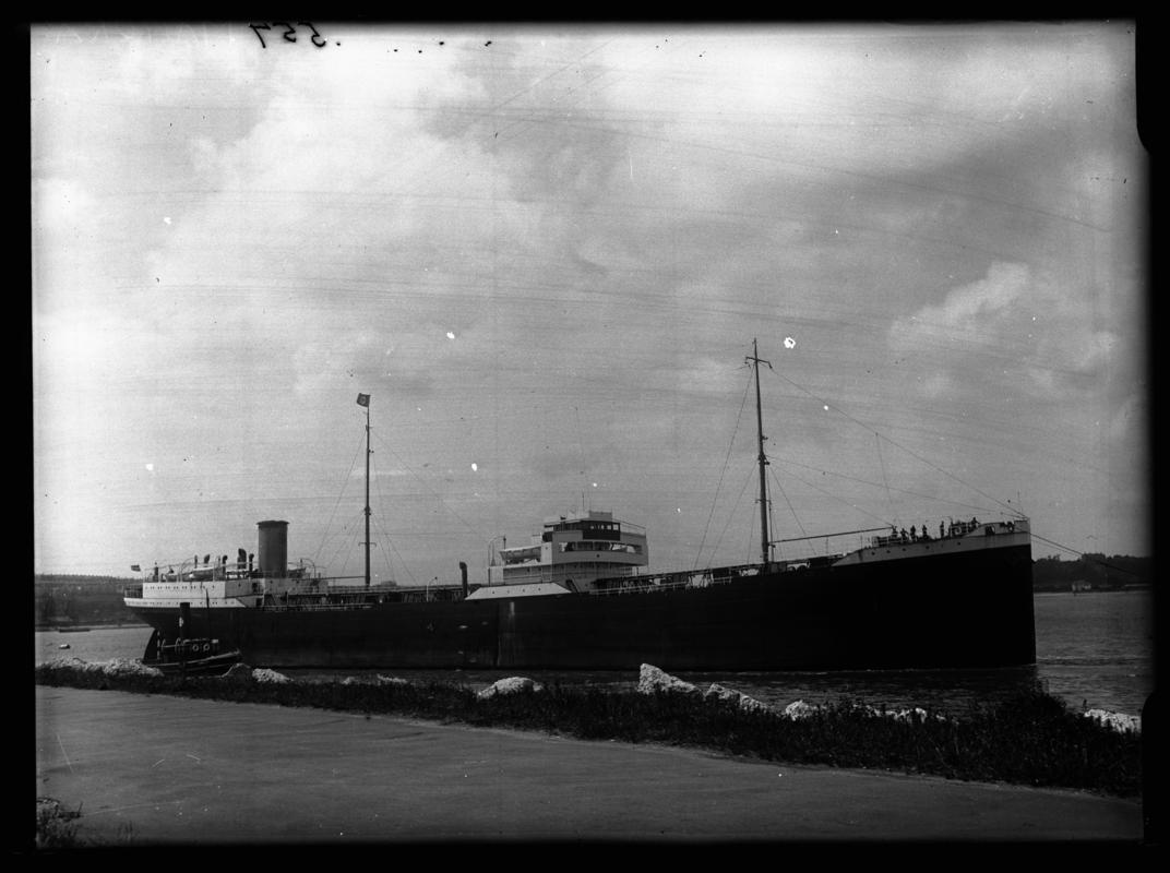 Starboard broadside view of M.V. MAMURA and tug, c.1936.