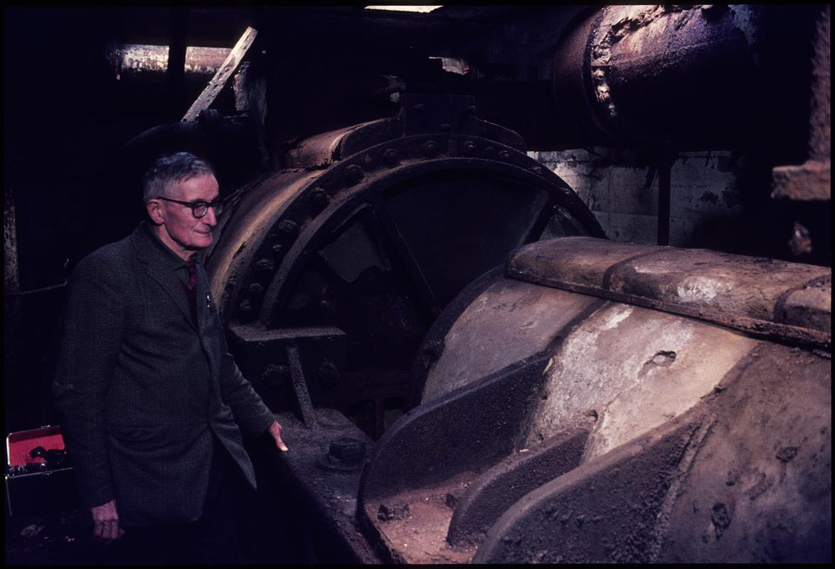 Colour film slide showing the Davey pumping engine which was installed at Llanover in 1913 and George Watkins, the expert on the stationary steam engine.