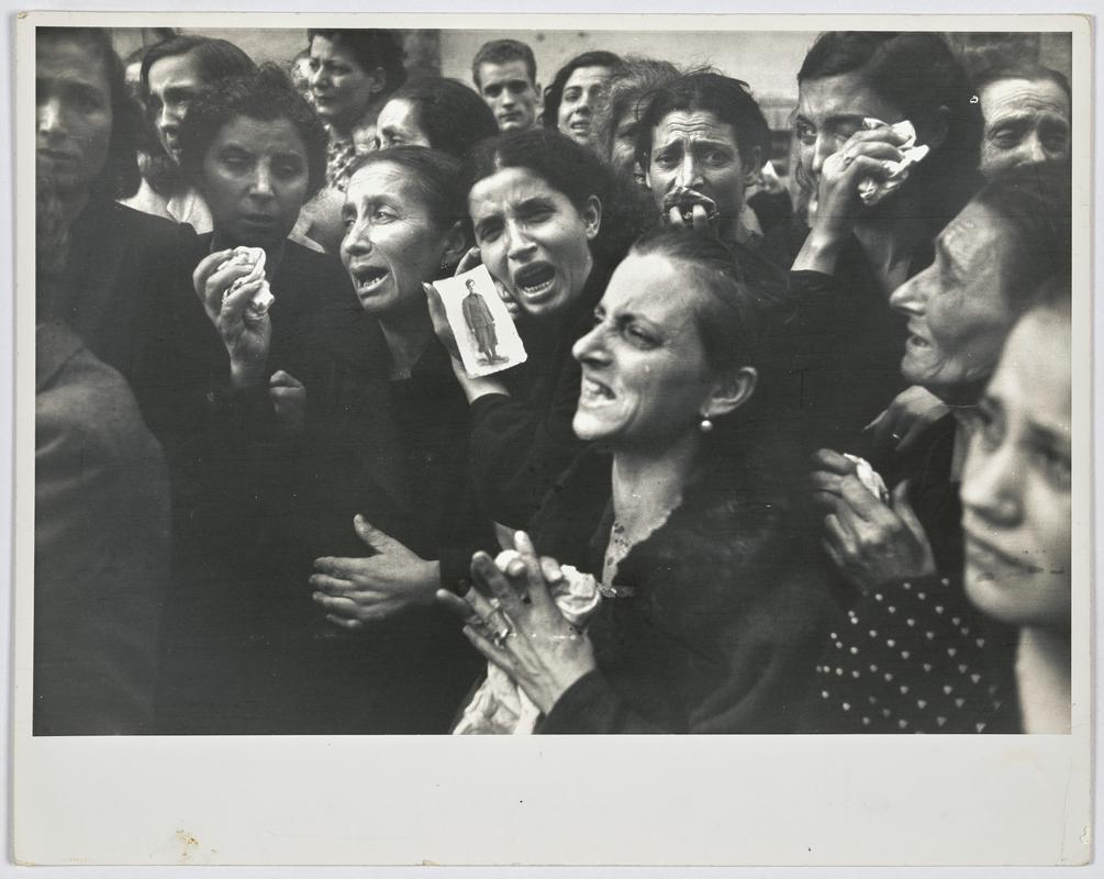 Women crying at funeral of twenty teenage partisans who had fought the germans before the Allies entered the city. Naples, Italy