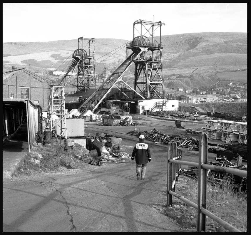 Black and white film negative of a photograph showing the two head gears at Wyndham Colliery with the Western shaft in the distance.