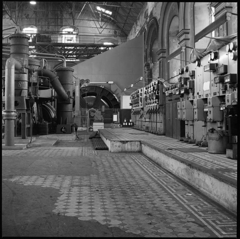 Black and white film negative showing the compressors and electric winder for the downcast shaft at Penallta Colliery, 9 April 1981.