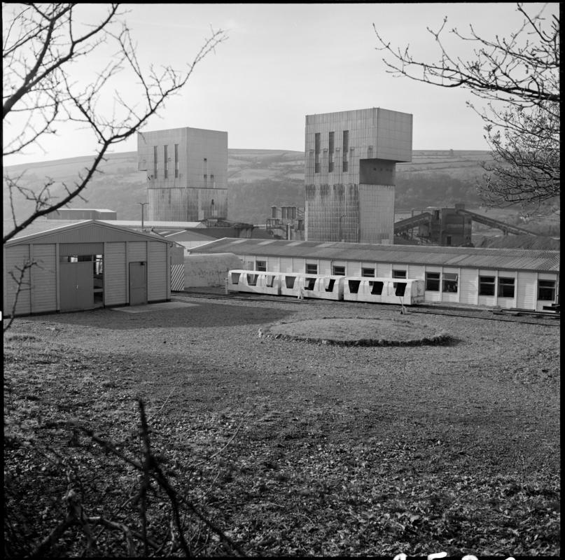 Black and white film negative showing a surface view of Abernant Colliery, 1980.  &#039;Abernant&#039; is transcribed from original negative bag.