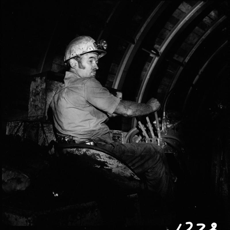 Black and white film negative showing a man operating an Eimco machine,  Blaengwrach Mine, 1 November 1979.  &#039;Blaengwrach 1 Nov 1979&#039; is transcribed from original negative bag.