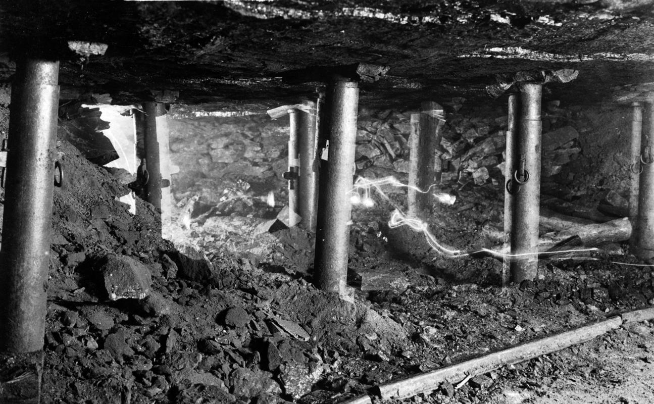 Iron roof props in use underground