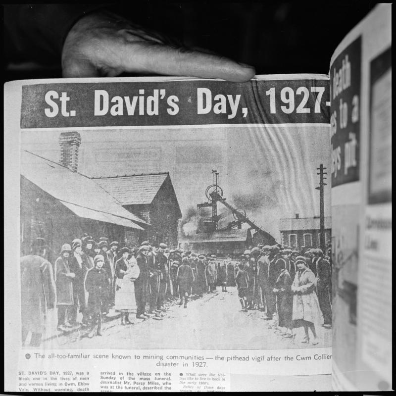 Black and white film negative showing &#039;the pithead vigil after the Cwm Colliery disaster in 1927&#039;, photographed from a publication.