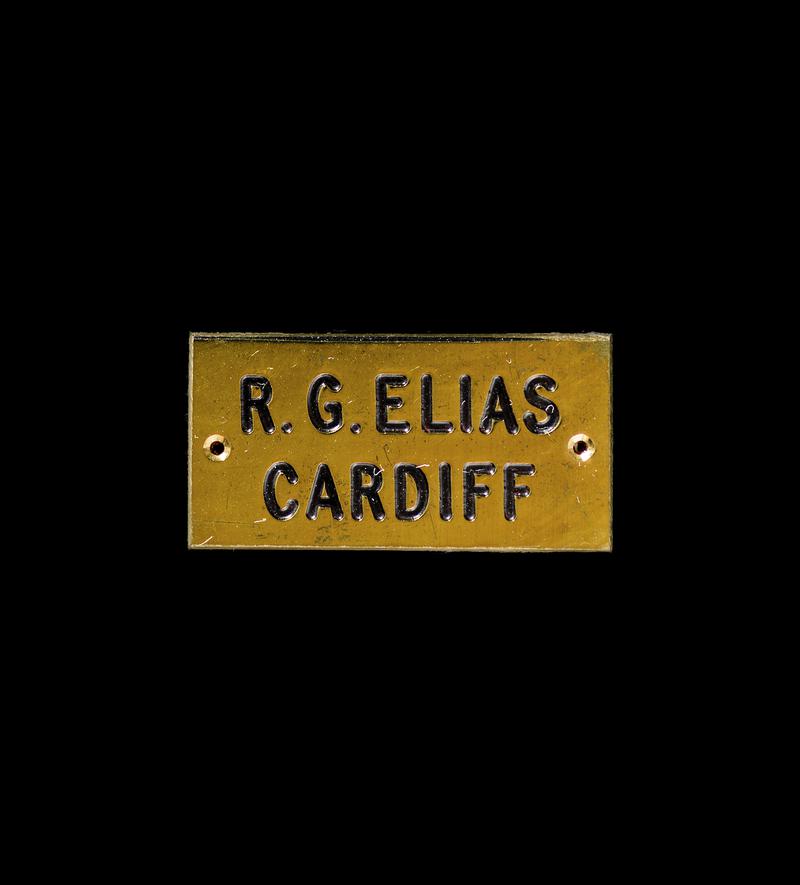 Brass plaque, possibly for chair backs in the Coal Exchange, Cardiff.