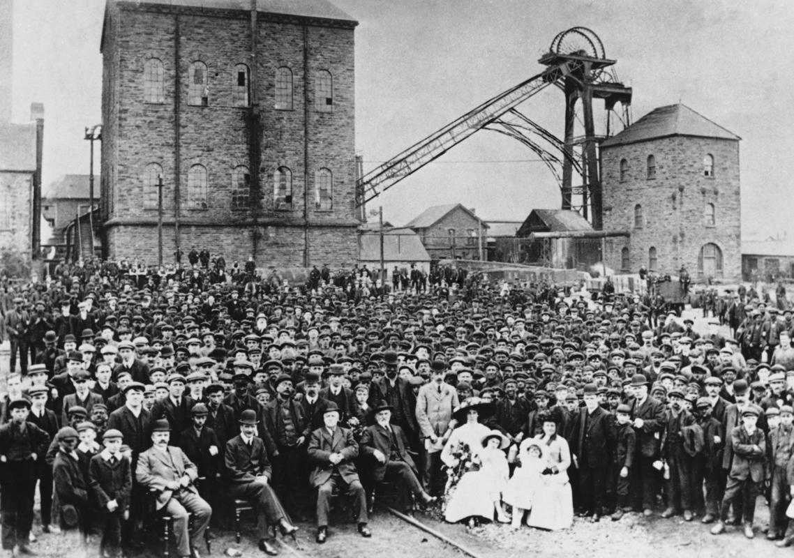 Workforce and management of Deep Navigation Colliery, Treharris, taken to commemorate a visit by David Davies MP and Mrs Davies.