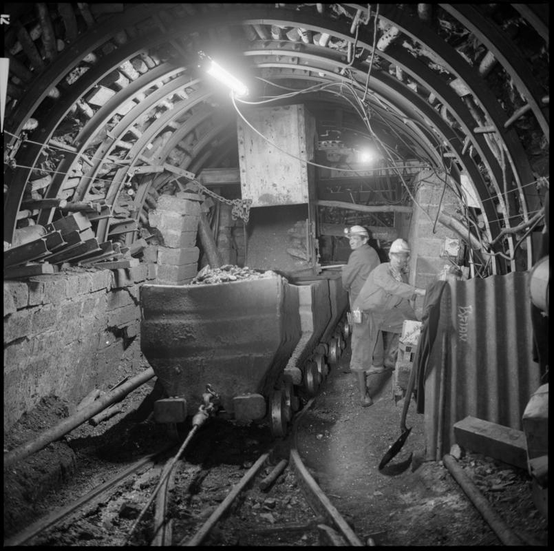 Black and white film negative showing an underground transfer point, Ammanford Colliery 7 September 1976.  &#039;Ammanford 7 Sep 1976&#039; is transcribed from original negative bag.
