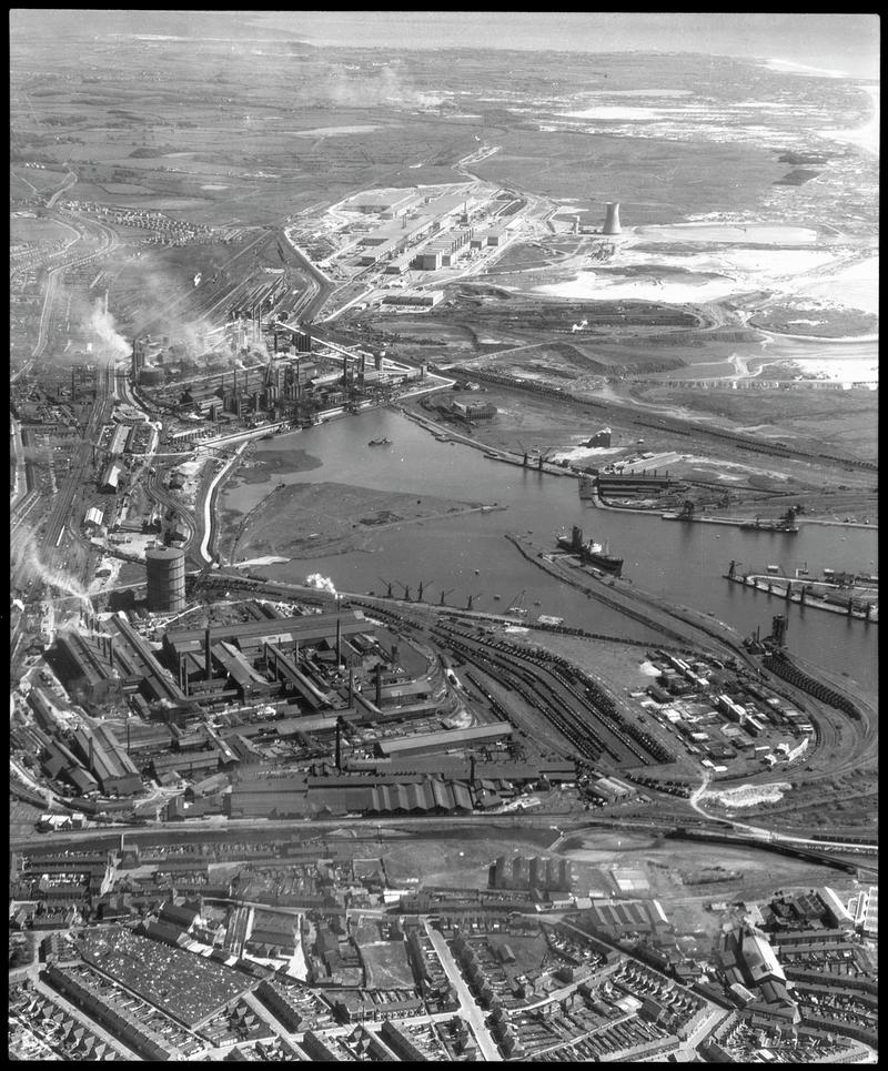 Aerial view of Port Talbot Steelworks in foreground, Margam Steelworks at middle distance, and Abbey Steelworks in the far distance.
