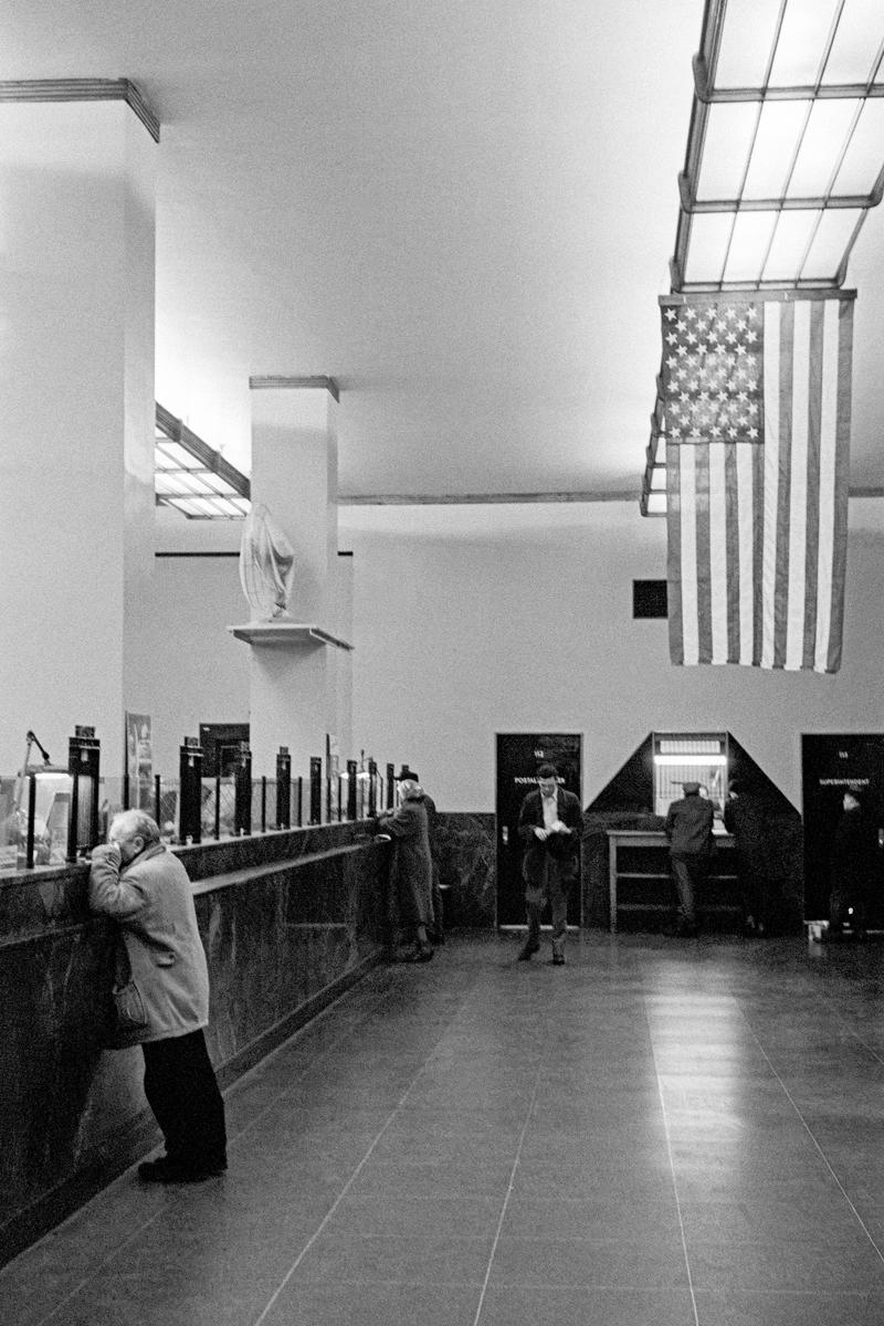 USA. NEW YORK. Manhattan. Interior of bank and the American flag. 1962