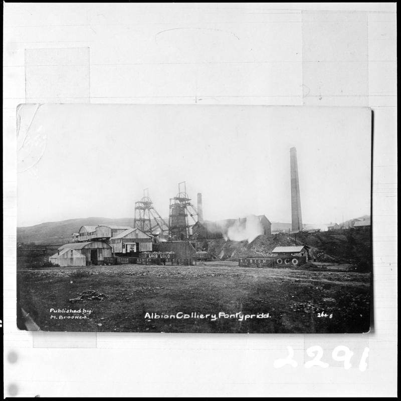 Black and white film negative of a photograph showing a surface view of Albion Colliery, Pontypridd.