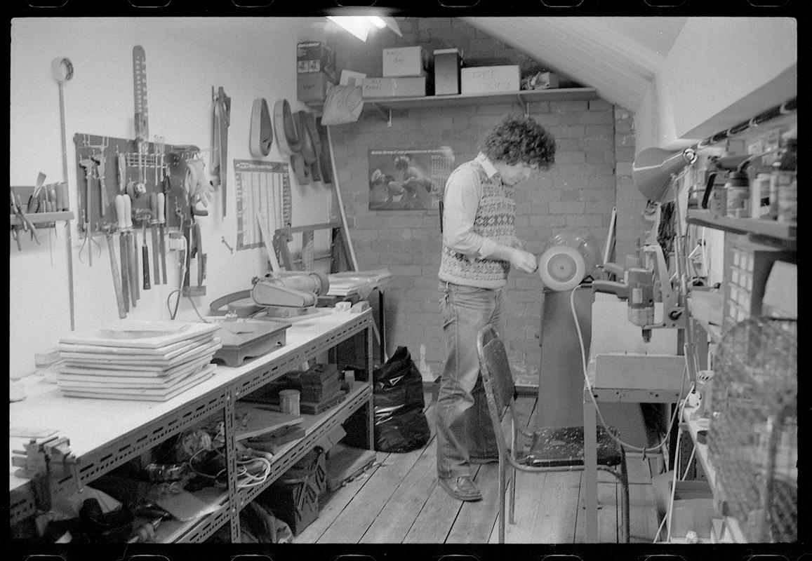 Craftsman working on a sundial.