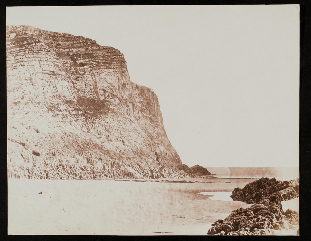 Beach with cliffs, photograph