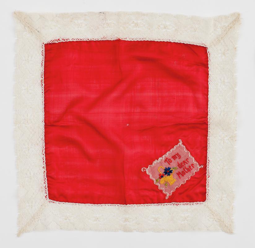 Red silk handkerchief embroidered with the inscription &#039;To my dear Mother&#039;.