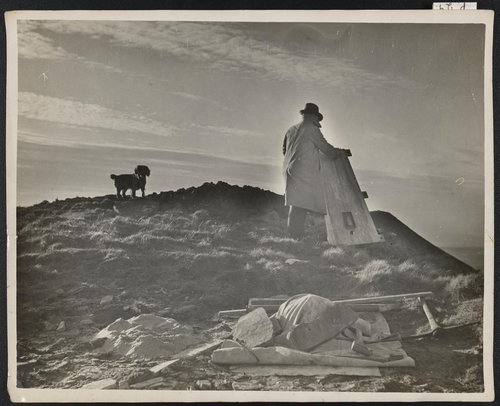 Llew putting up Trig Point, Cribarth, with Buddy