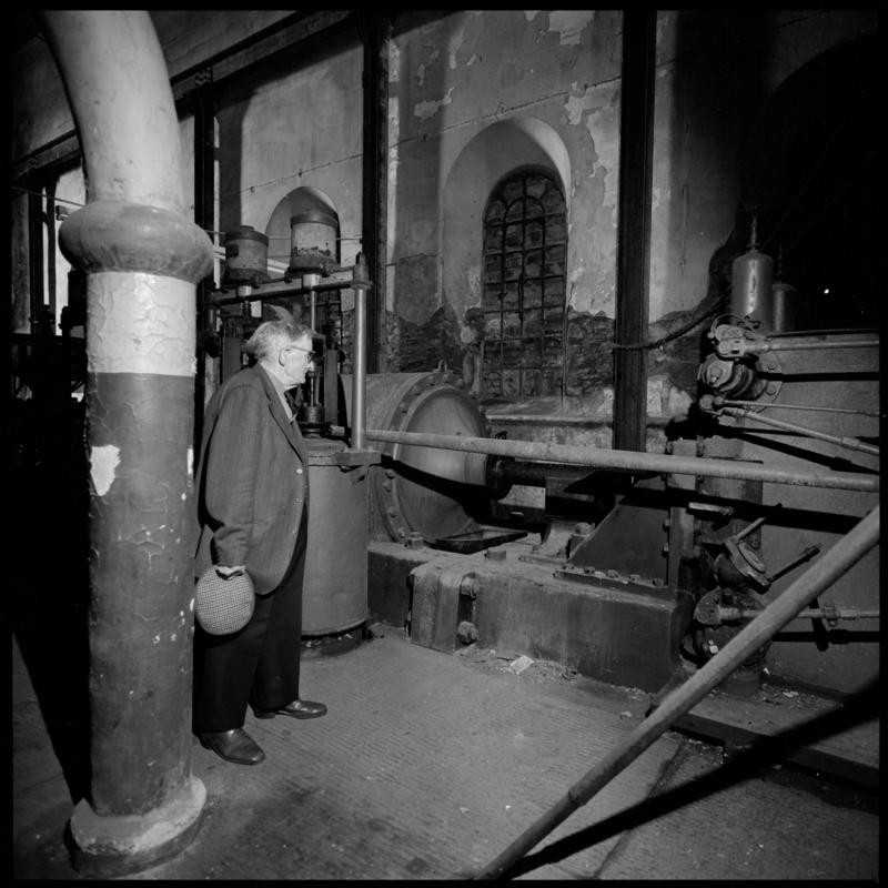 Black and white film negative showing George Watkins in the widing engine house, Elliot Colliery.  &#039;East Elliot&#039; is transcribed from original negative bag.