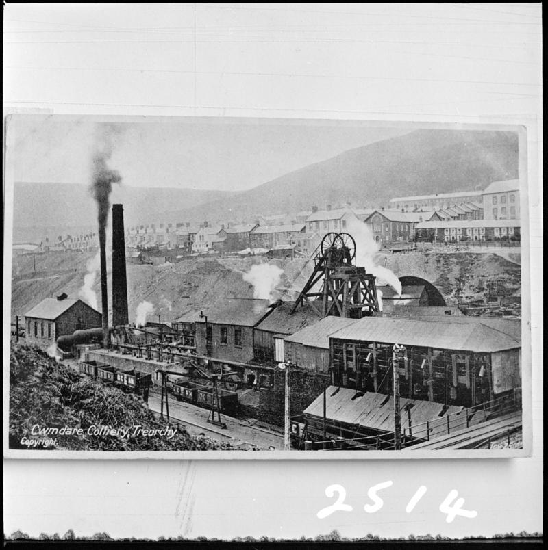 Black and white film negative of a photograph showing a surface view of Cwmdare Colliery. &#039;Cwmdare&#039; is transcribed from original negative bag.