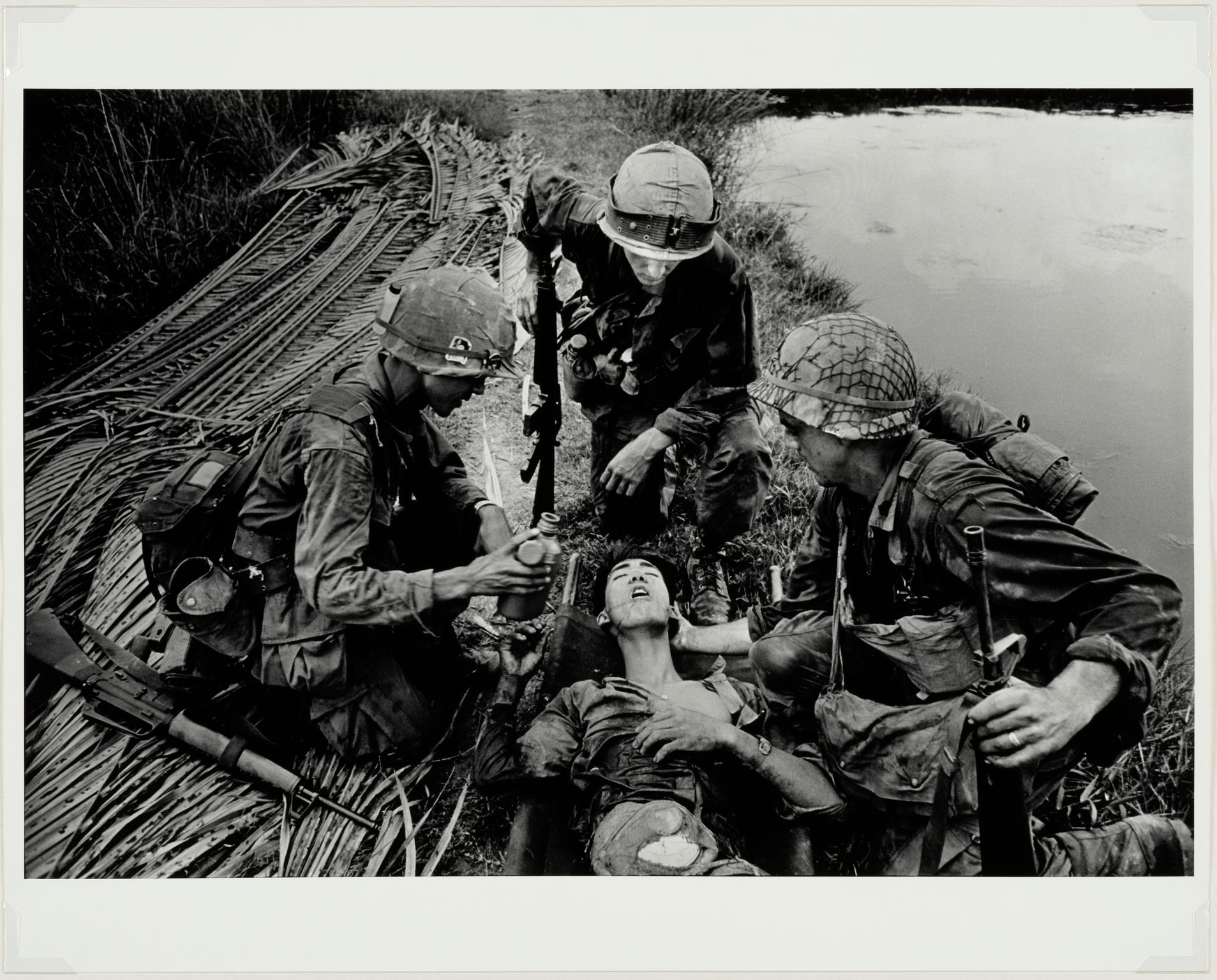 G.I.'s with wounded Vietcong, 1968