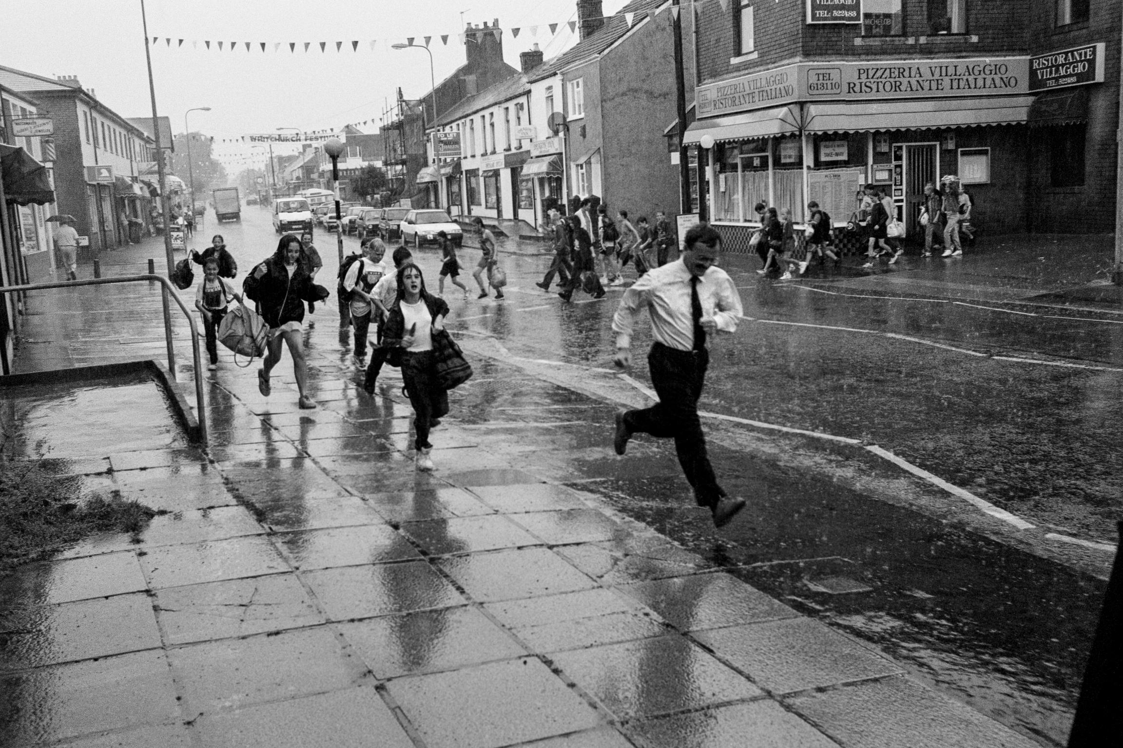 Running from rain in Whitchurch. Cardiff, Wales