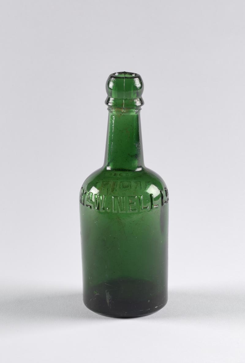 Green glass beer bottle with inscription &#039;Wm. W. Nell - Cardiff&#039;. - William Walter Nell Ltd was a Cardiff brewery first registered 1890. It was this brewery that supplied The Vulcan Hotel until Nell&#039;s was acquired by Crosswells Cardiff Brewery in 1927.