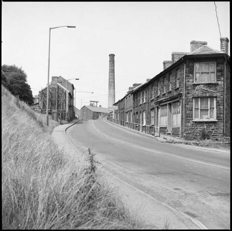 Black and white film negative showing houses, and Lewis Merthyr Colliery in the background.  &#039;Lewis Merthyr&#039; is transcribed from original negative bag.