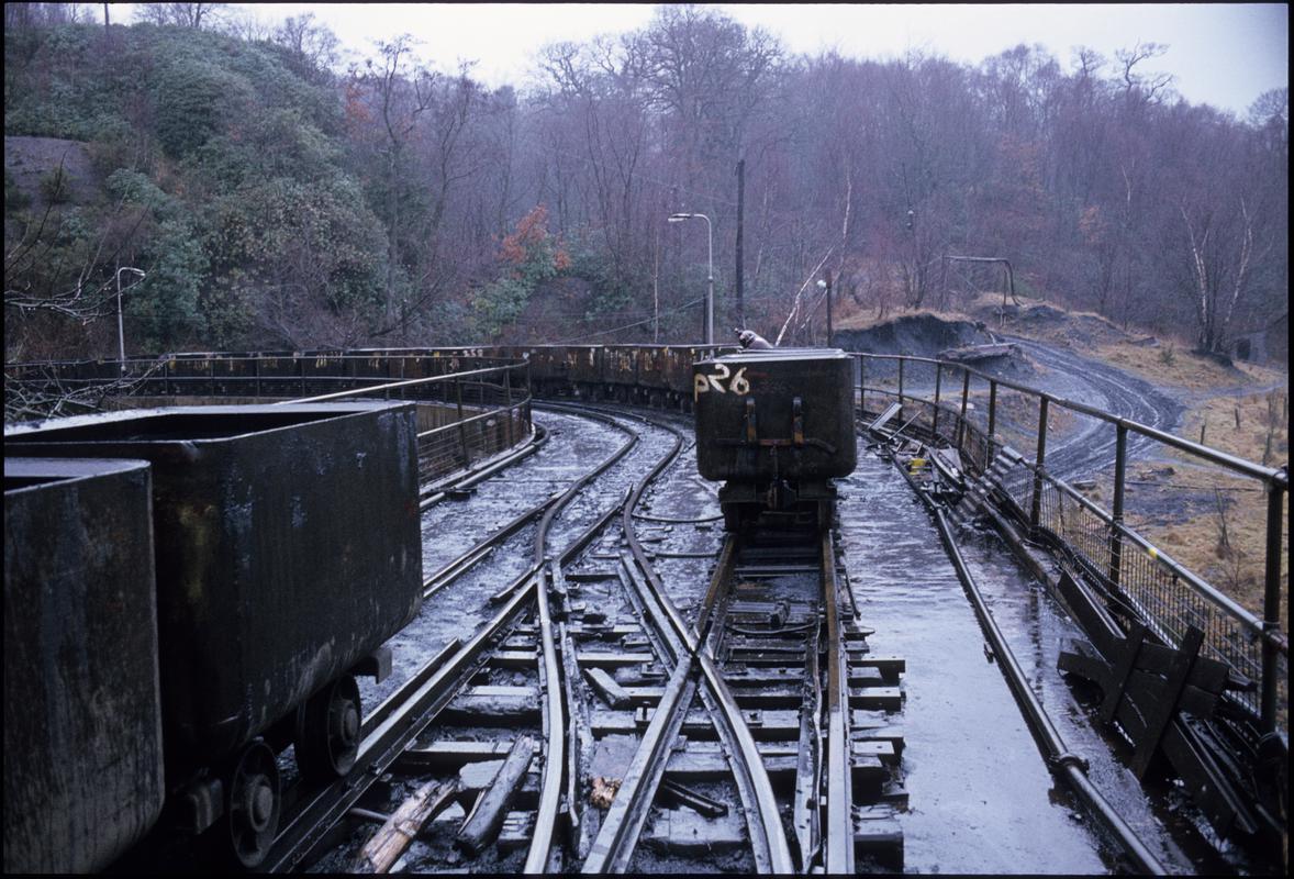 Colour film slide showing a row of drams, Aberpergwm Colliery.