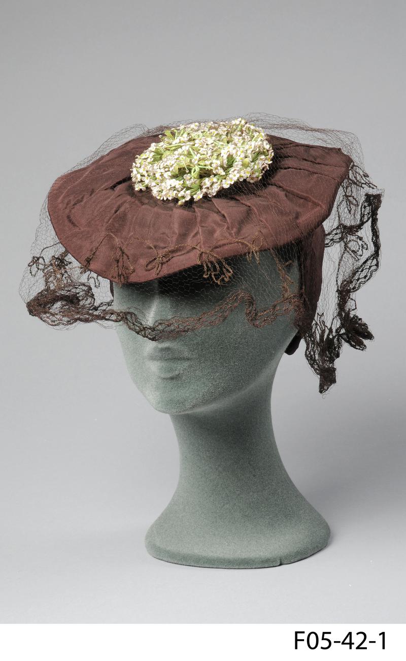 Brown hat of artificial silk with very shallow crown