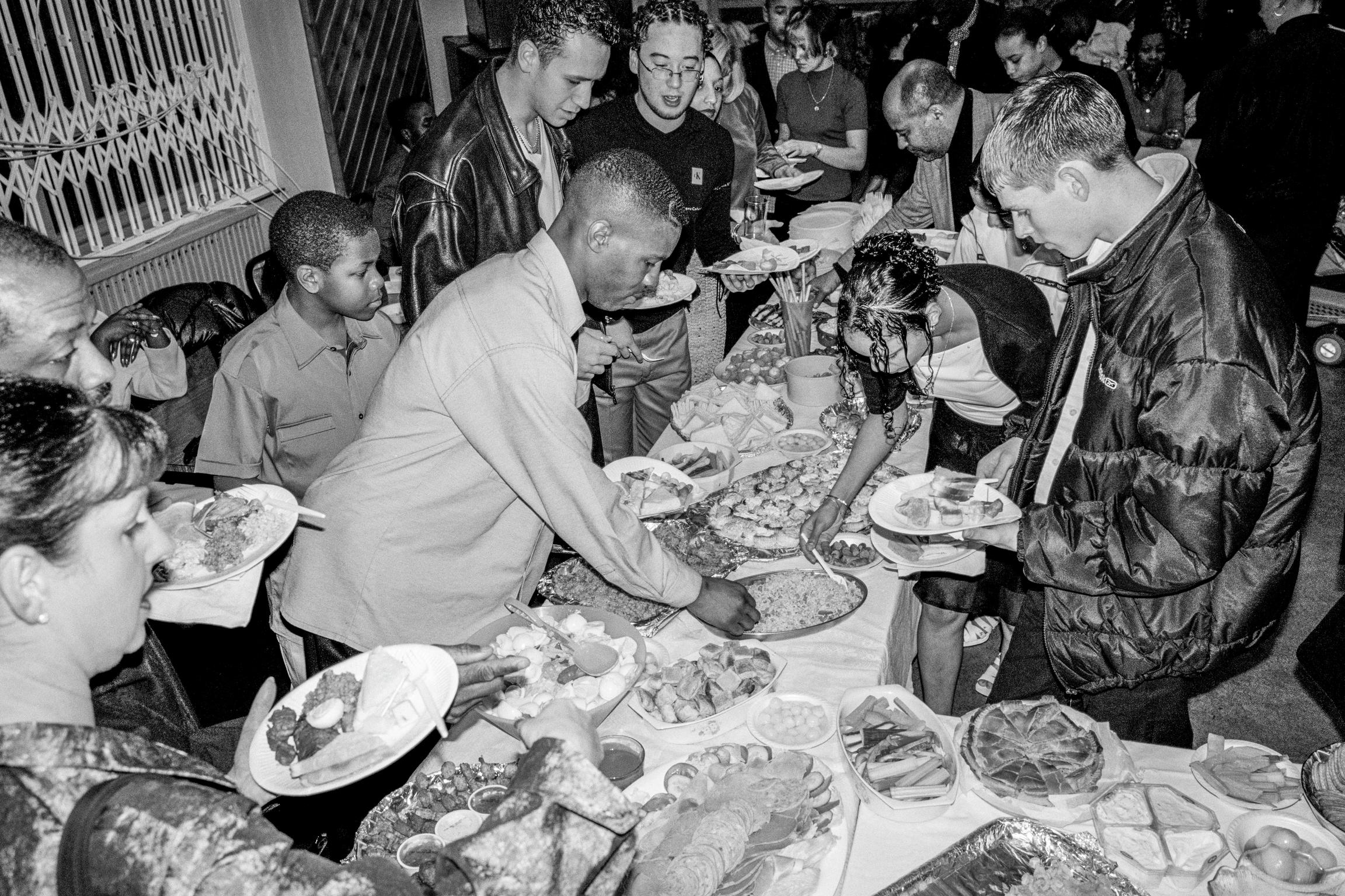 Food (multi-cultural) at a party after a Baptism held at Butetown Community Centre. Cardiff, Wales