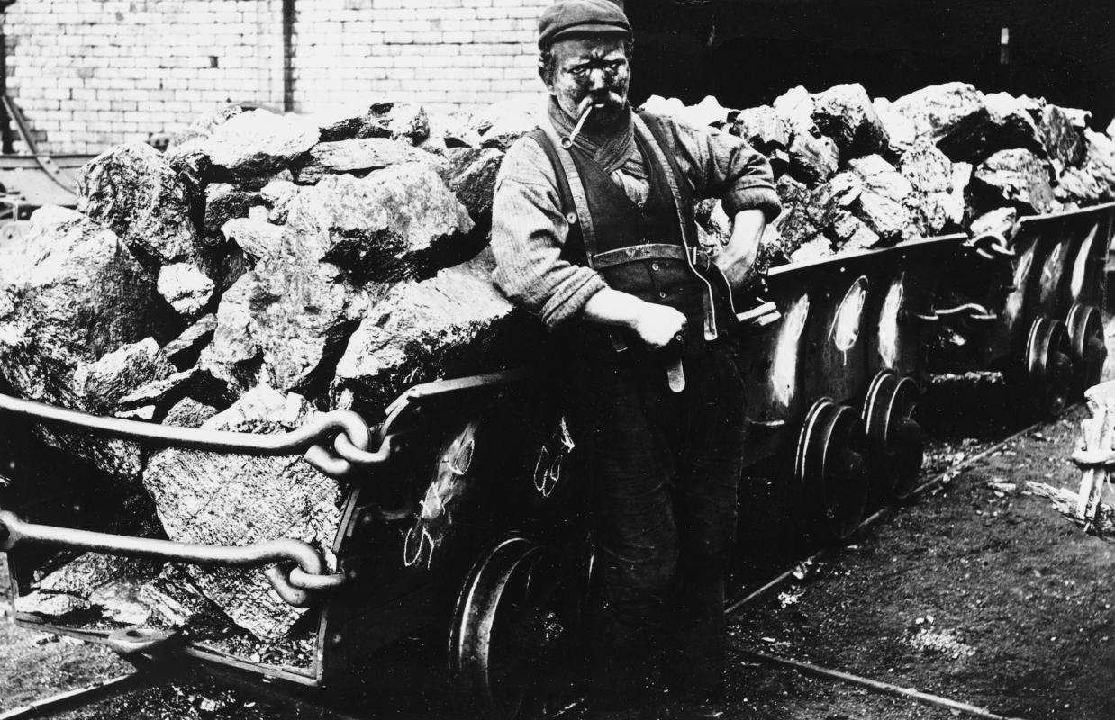 Miner with raced trams of coal, Lewis Merthyr Colliery