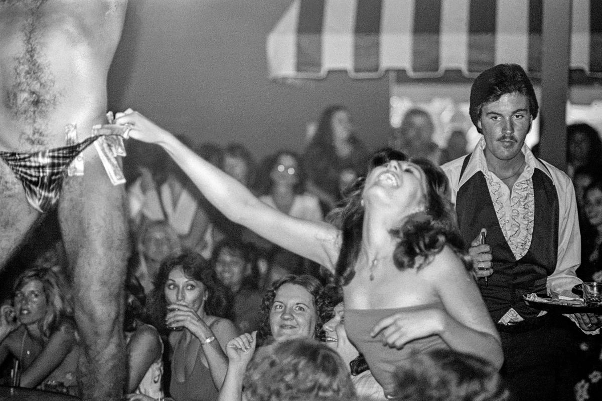 USA. ARIZONA. Phoenix  &quot;Cheeks&quot; a ladies only club just outside the city limits of Phoenix.  Male strippers are the main entertainment of the evening. 1980.