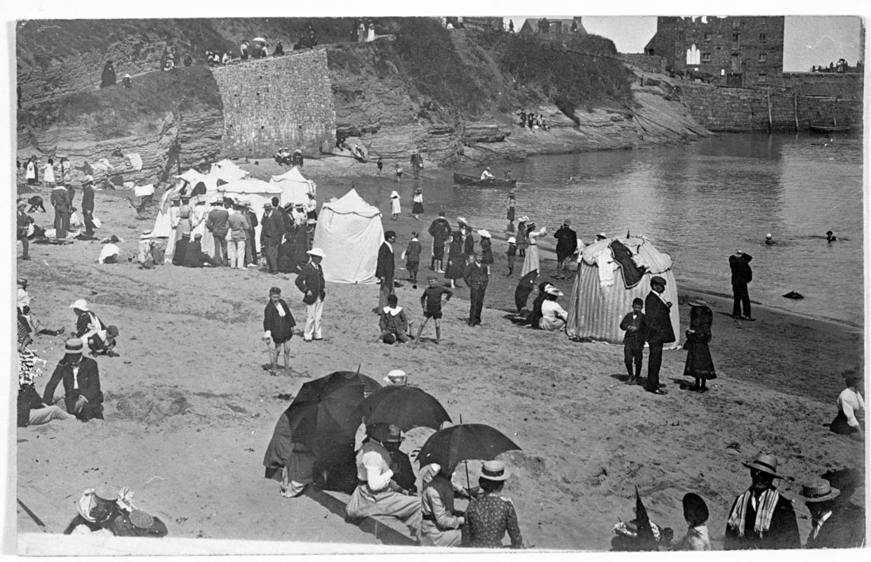 Holiday makers on beach in Newquay, Cardiganshire