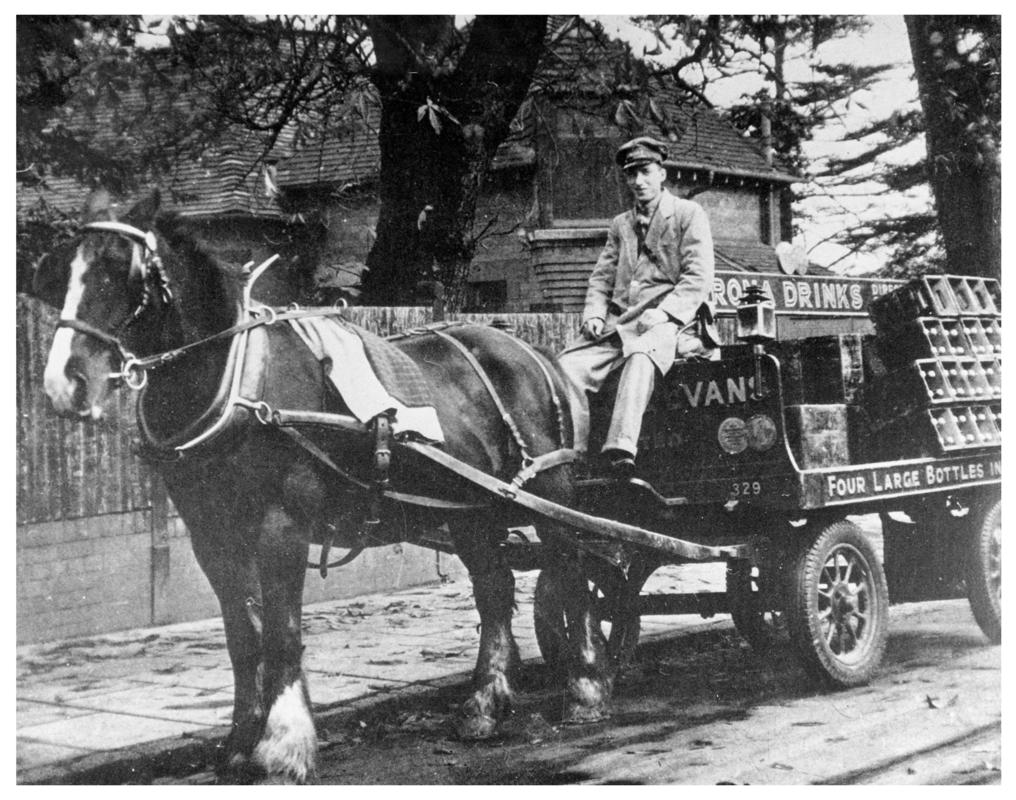 Corona Drinks delivery man on horse drawn cart.