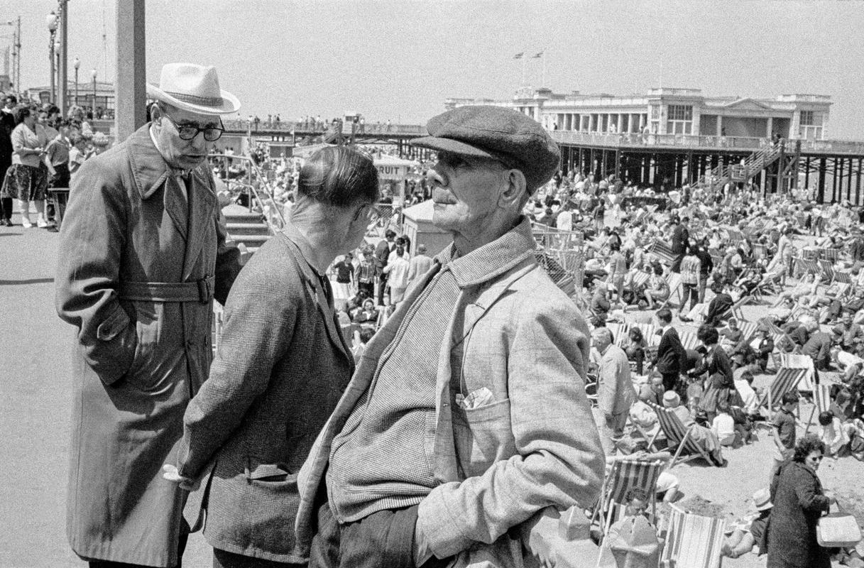 GB. ENGLAND. Herne Bay. Three elderly friends take a stroll on the sea front at Margate in Kent. 1963