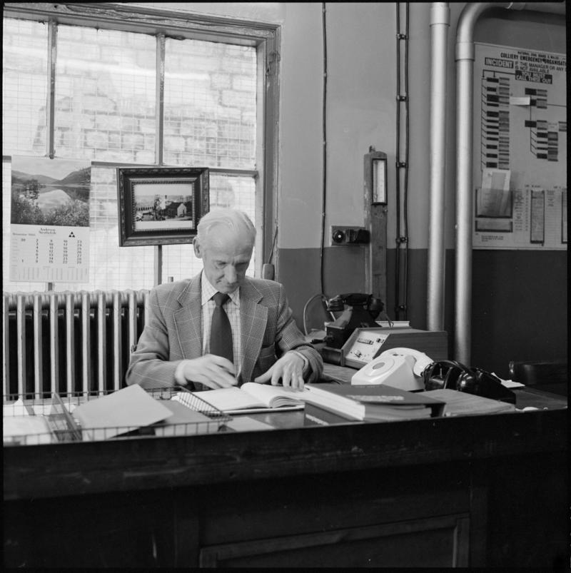 Black and white film negative showing Glyn Morgan, the last NCB manager, in his office, Big Pit Colliery 28 November 1980.  &#039;28 Nov 1980&#039; is transcribed from original negative bag.