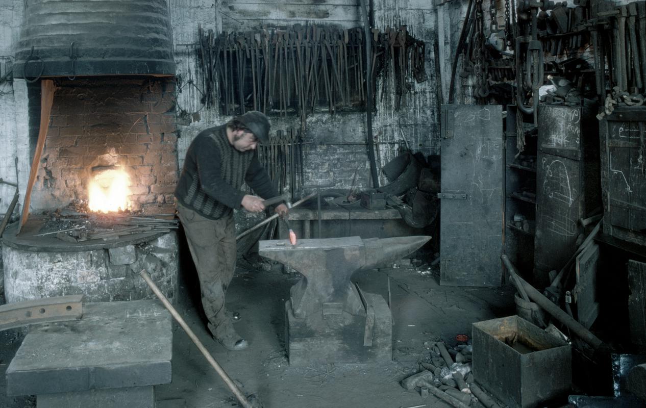 Blacksmith working in Smithshop at Beynon colliery,
