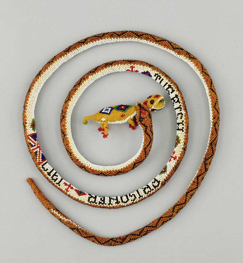 Beadwork model of a snake holding a chameleon