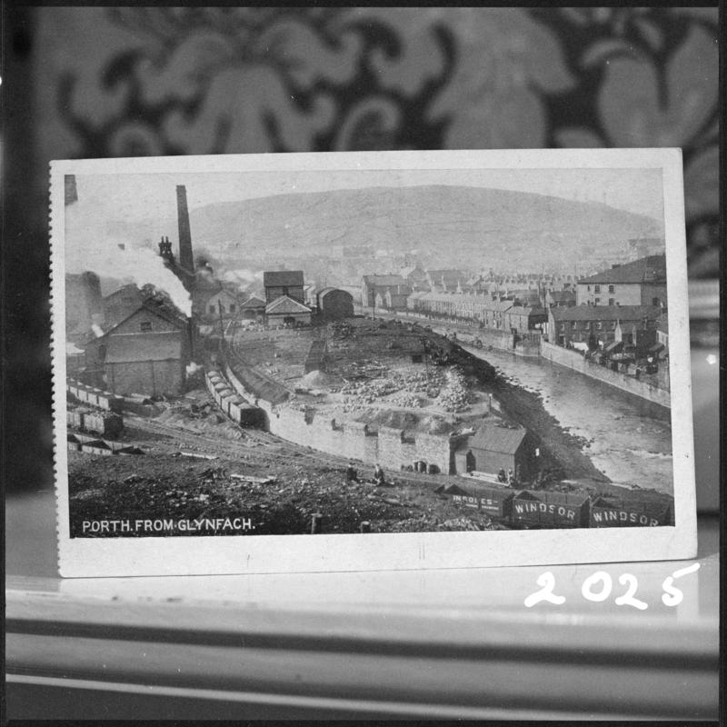 Black and white film negative of a photograph showing a landscape view of Cymmer Colliery, Porth, taken from Glynfach.  &#039;Cymmer&#039; is transcribed from original negative bag.