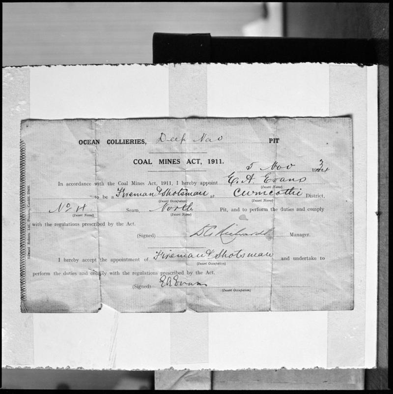 Black and white film negative showing a document appointing &#039;E.A. Evans to be a Fireman &amp; Shotsman 5 Nov 1934&#039;.  &#039;Deep Navigation&#039; is transcribed from original negative bag.