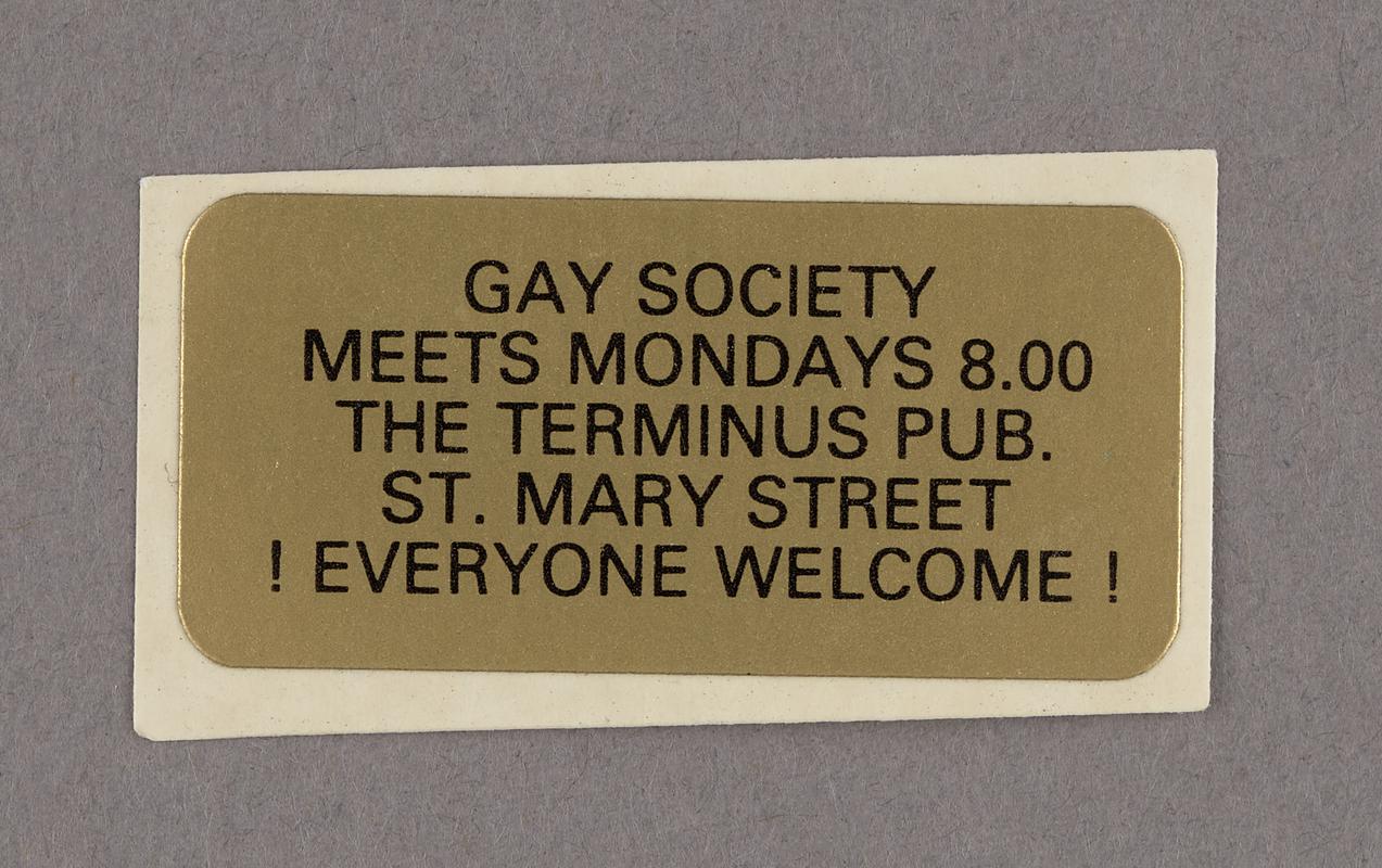Gold sticker from late 1984 used to advertise Cardiff University Gay Society (Gay Soc) meetings.