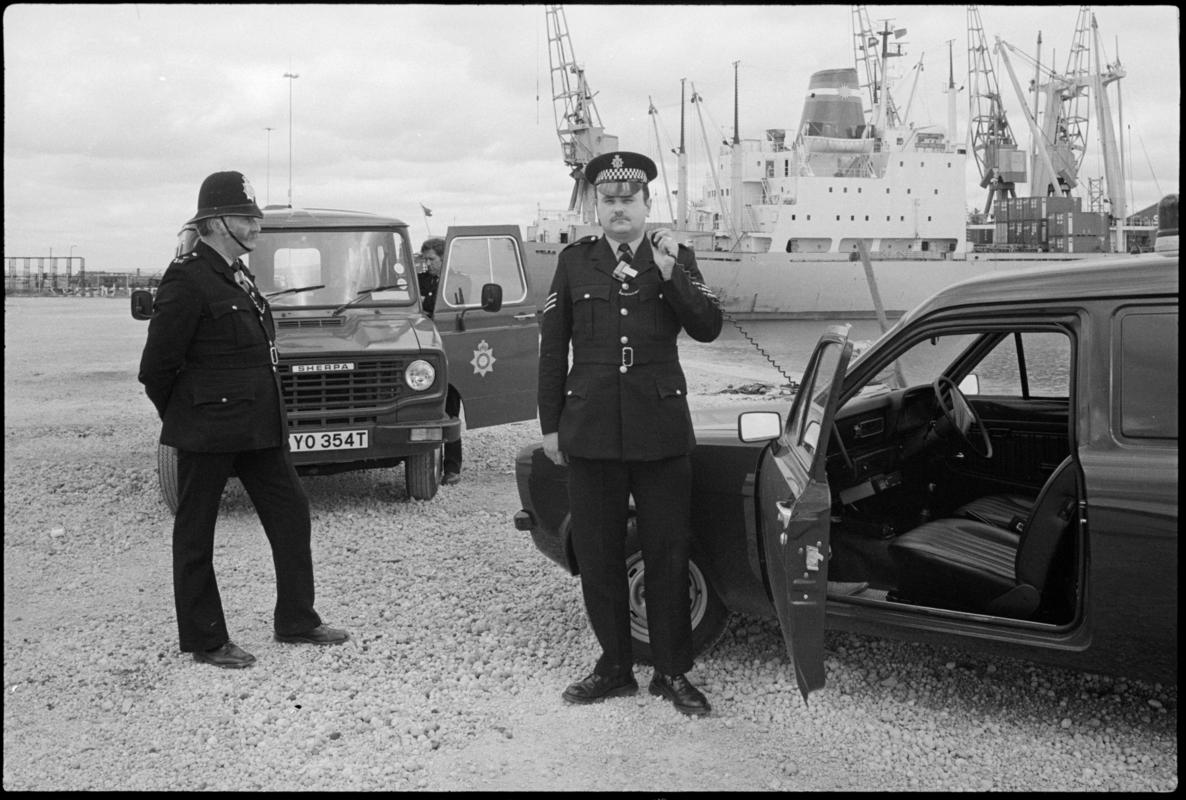 British Transport (Docks) Police at Queen Alexandra Docks, Cardiff. Vessel in the background. The policeman wearing a helmet is PC William Power, the longest serving policeman (34 years) who started with the Great Western Railway.