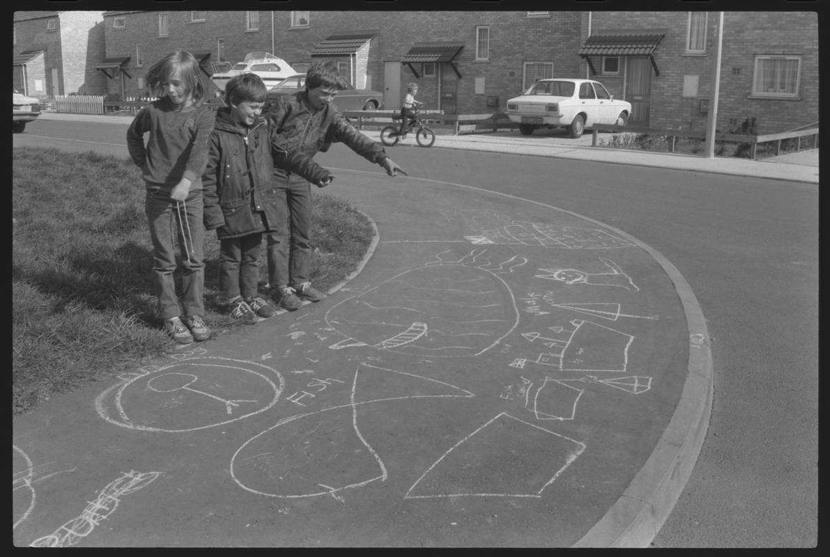 Children playing outside new houses at Eleanor Place, Butetown.