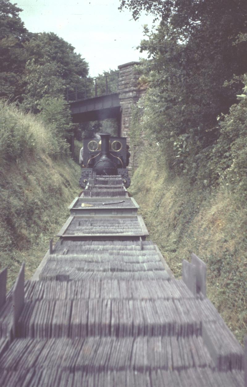 Steam engine and a run of loaded wagons, Penrhyn Quarry Railway