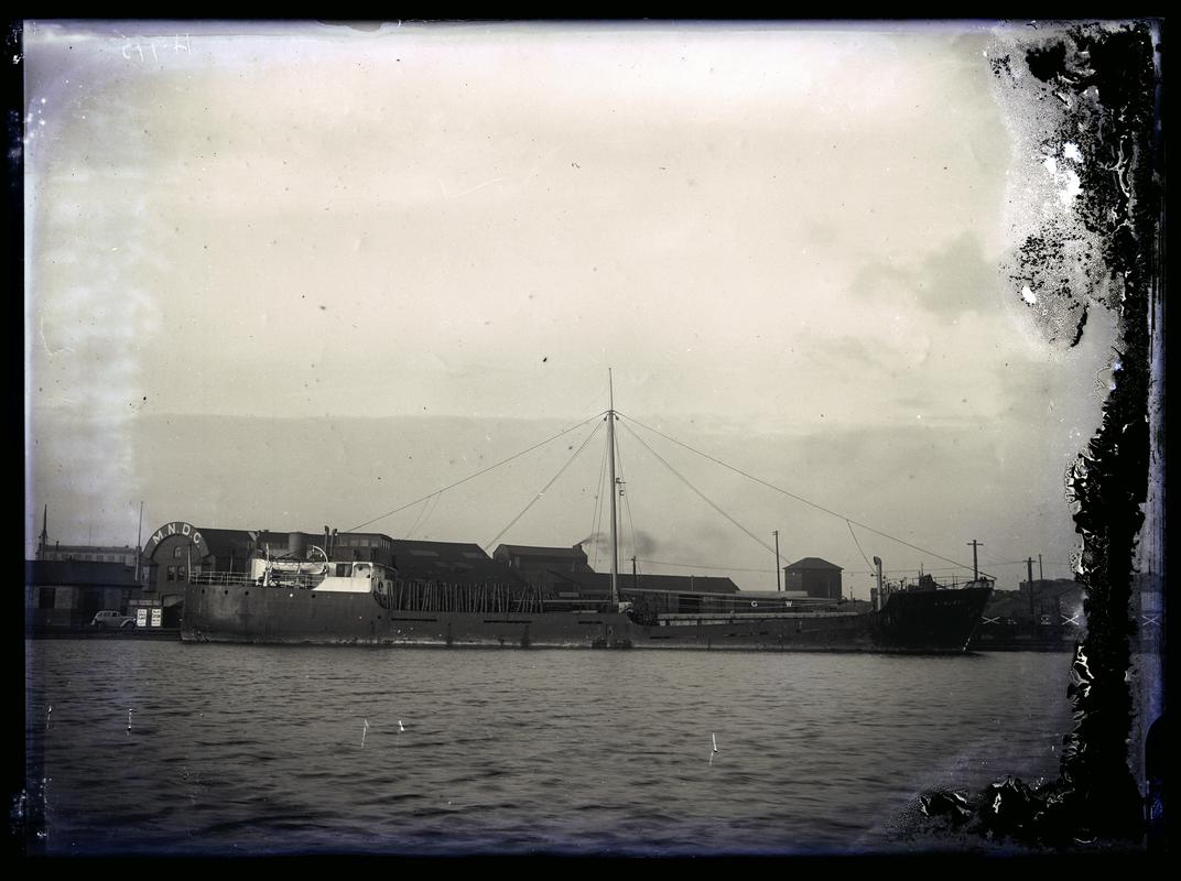 Port broadside view of M.V. ASHANTI at Cardiff Docks, c.1936.