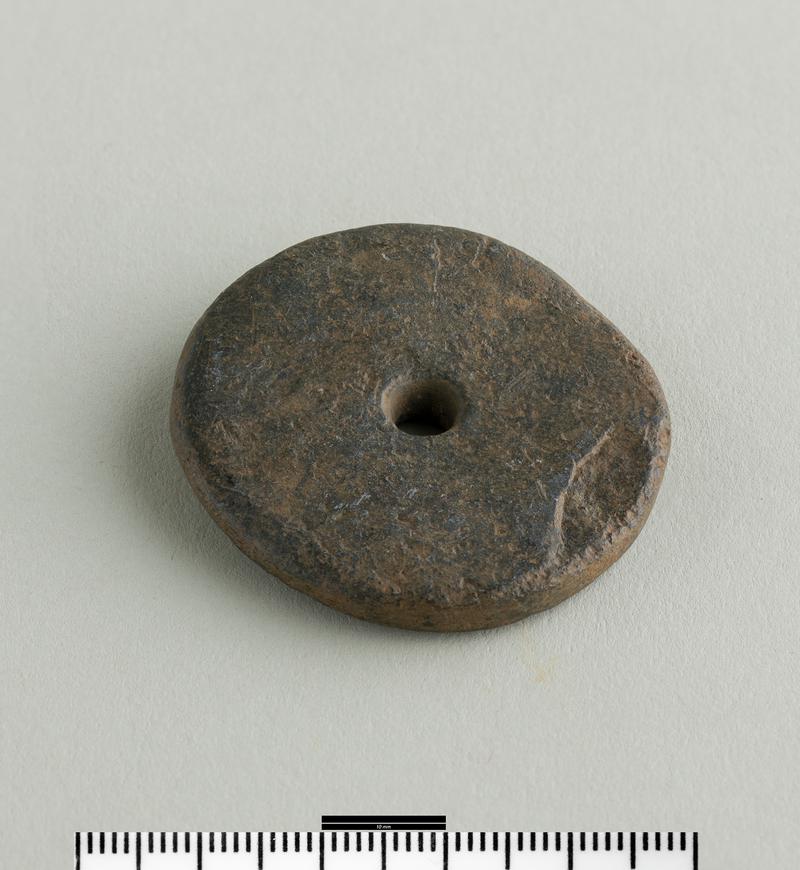 Iron Age / Roman slate spindle whorl
